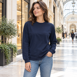 American Apparel 1304 in True Navy, a stylish woman aged 29 at a bright contemporary indoor shopping arcade with glass and cream stone; illustrative lifestyle mockup