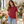 American Apparel 2001 in Cranberry, a stylish woman aged 28 at a sunlit minimalist flower shop with warm white walls and elegant foliage; illustrative lifestyle mockup