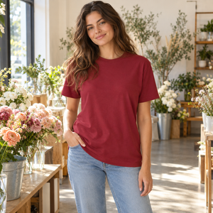 American Apparel 2001 in Cranberry, a stylish woman aged 28 at a sunlit minimalist flower shop with warm white walls and elegant foliage; illustrative lifestyle mockup