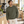 American Apparel RF496 in Lieutenant, a stylish man aged 33 at a sunlit contemporary coffee roastery with modern clean lines and pale wood; illustrative lifestyle mockup