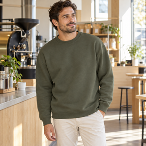 American Apparel RF496 in Lieutenant, a stylish man aged 33 at a sunlit contemporary coffee roastery with modern clean lines and pale wood; illustrative lifestyle mockup
