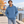 American Apparel RF498 in Sea Blue, a stylish man aged 30 at a modern Montreal waterfront promenade in soft bright autumn daylight; illustrative lifestyle mockup