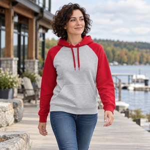 ATC ATCF2550 Athletic Heather/Red unisex two-tone hoodie — premium understated lakeside athletic club exterior lifestyle photograph