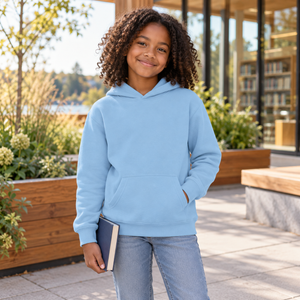 ATC ATCY2500 Light Blue youth pullover hoodie — premium bright community library terrace with warm timber planters lifestyle photograph