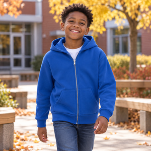 ATC ATCY2600 Royal youth full-zip hoodie — premium tidy school courtyard with natural wood benches and autumn leaves lifestyle photograph