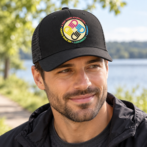 A Tiny Town Foundation Flexfit 110M Mesh Cap — Black — lifestyle mockup