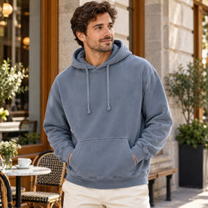Comfort Colors 1567 Unisex Garment-Dyed Hooded Sweatshirt outside a Montreal cafe