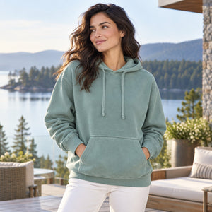 Comfort Colors 1567 Unisex Garment-Dyed Hooded Sweatshirt on a lakeside terrace