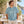 Comfort Colors 1745 Unisex Colorblast Heavyweight T-Shirt at a beachside cafe