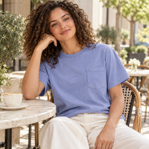 Comfort Colors 6030 Unisex Garment-Dyed Heavyweight Pocket T-Shirt at an outdoor bistro
