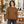 Woman wearing the CSW 24/7 L00540 Caramel crewneck sweatshirt in a bright restaurant