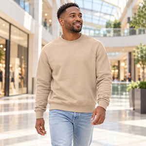 Man wearing the CSW 24/7 L00540 Sand crewneck sweatshirt in a modern shopping mall