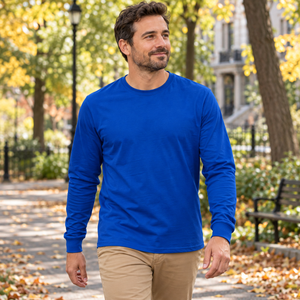 Man wearing a Royal Blue CSW 24/7 Breeze S05615 long sleeve T-shirt in a neighbourhood park