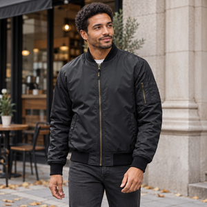Model wearing the CX2 L09300 men's insulated bomber jacket in Black — lifestyle photo