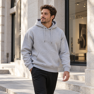 Independent Trading Co. IND5000P Grey Heather heavyweight hoodie styled outside a Montreal gallery