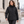 Model wearing the CORE365 Women's 3-in-1 Jacket with Fleece Liner – 78205 in a lifestyle setting - Black