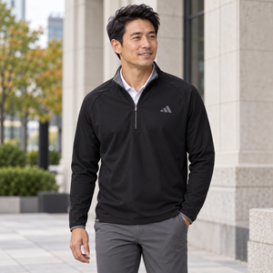 Model wearing the Adidas Men's Ultimate365 Wind Quarter-Zip Pullover – A2027 in a lifestyle setting - Black