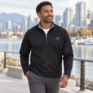 Model wearing the Adidas Men's Ultimate365 Wind Quarter-Zip Pullover – A2027 in a lifestyle setting - Black