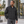 Model wearing the Adidas Men's Wind Resistant Full-Zip Jacket – A267 in a lifestyle setting - Black/ Black