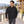 Model wearing the Adidas Men's Wind Resistant Full-Zip Jacket – A267 in a lifestyle setting - Black/ Black