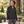 Model wearing the Adidas Women's Wind Resistant Full-Zip Jacket – A268 in a lifestyle setting - Black/ Black