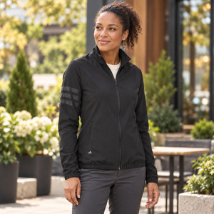 Model wearing the Adidas Women's Wind Resistant Full-Zip Jacket – A268 in a lifestyle setting - Black/ Black