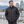 Model wearing the Adidas Men's 3-Stripes Puffer Full-Zip Jacket – A570 in a lifestyle setting - Black