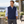 Model wearing the Adidas A599 Club Vest in a lifestyle setting - Collegiate Navy