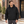 Model wearing the Harriton Unisex ClimaBloc® Heavyweight Hooded Full-Zip Jacket – M722 in a lifestyle setting - Black