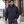 Model wearing the Harriton Unisex ClimaBloc® Heavyweight Hooded Full-Zip Jacket – M722 in a lifestyle setting - Dark Navy