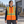 Model wearing the CX2 Hi-Vis Quilted Vest in a lifestyle setting - Orange