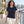 Woman wearing the M&O 4513 Fine Navy crewneck T-shirt on a marina boardwalk