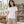 Woman wearing the M&O 4513 Fine White crewneck T-shirt in a sunlit ceramics workshop