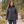 Woman wearing the Muskoka Trail L00901 Canyon Ladies Puffy Jacket with Detachable Hood in a realistic lifestyle setting - Charcoal