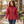 Woman wearing the Muskoka Trail L00901 Canyon Ladies Puffy Jacket with Detachable Hood in a realistic lifestyle setting - Red