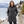Woman wearing the Muskoka Trail L00903 Glacier Bay Ladies Full Length Puffy Jacket with Detachable Hood in a realistic lifestyle setting - Charcoal