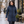 Woman wearing the Muskoka Trail L00903 Glacier Bay Ladies Full Length Puffy Jacket with Detachable Hood in a realistic lifestyle setting - Navy