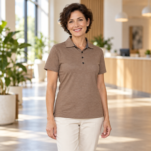 Woman wearing the Muskoka Trail S05751 Fairway Ladies Cotton/Poly Jersey Polo in a realistic lifestyle setting - Melange Taupe