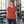 Woman wearing the Muskoka Trail S05918 Liberty Ladies Poly/Cotton Crewneck T-Shirt in a realistic lifestyle setting - Melange Crimson