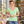 Next Level 1540 Women's Ideal V-Neck Tee in Mint — woman at a sunlit ceramics studio with handmade bowls on a shelf