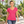 Next Level 1540 Women's Ideal V-Neck Tee in Raspberry — woman walking through a sculptural botanical conservatory