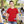 Next Level 3310 Youth Cotton Tee in Red — 13-year-old girl at an outdoor community art workshop
