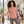 Next Level 3911 Women's Cotton Relaxed Long Sleeve Tee in Desert Pink — woman in a relaxed Pilates studio, stretching at a barre