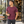 Next Level 6210 Unisex CVC Tee in Heather Maroon — man stepping out of a modern coffee roastery