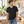 Next Level 6440 Unisex Sueded V-Neck Tee in Black — man browsing architectural prints at a bright design atelier