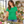 Next Level 6610 Women's CVC Tee in Kelly Green — woman teaching an informal flower arranging class in a bright studio