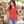 Next Level 6710 Women's Triblend Tee in Vintage Red — woman browsing a weekend outdoor makers market