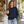Next Level 9000 Unisex Laguna Raglan Crewneck Sweatshirt in Midnight Navy — woman at a relaxed neighbourhood bakery window