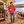 Next Level 9300 Unisex Malibu Welt Pocket Hoodie Sweatshirt in Heather Cardinal — man beside a vintage van at a fall lakeshore picnic