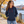 Next Level 9301 Unisex Laguna Hoodie Sweatshirt in Midnight Navy/ Cardinal — woman on a riverside promenade in crisp autumn weather